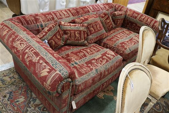 A very large two seater settee, upholstered with an Egyptian taste red, black and cream fabric W.235cm